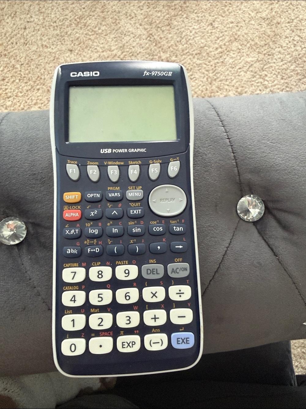 Casio graphing calculator in navy and white